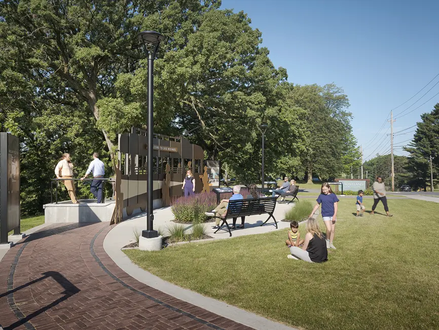 People interacting with Waveland Trolley loop monument